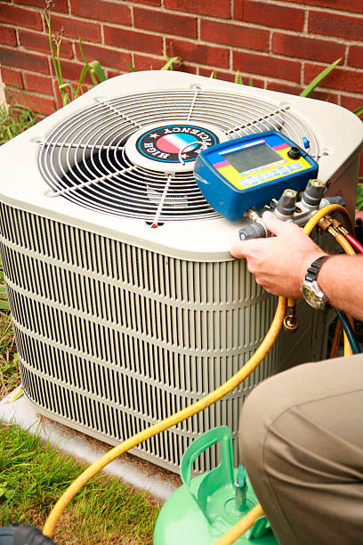 air conditioner being serviced.