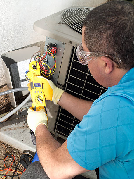 male hispanic air conditioning maintenance technician